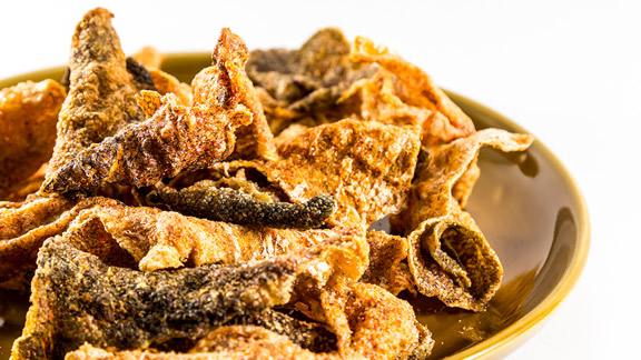 A photo of crispy fish skin. Such crispy fish skin is a popular snack in many countries.