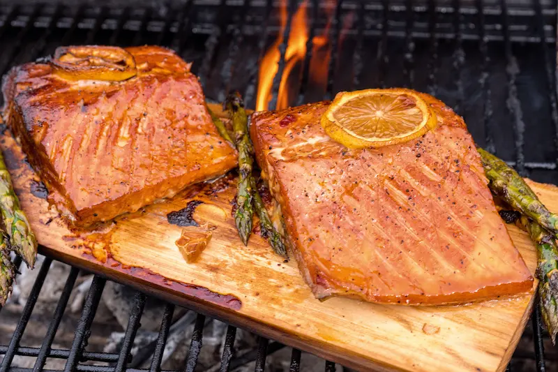 Seafood grilling: salmon on cedar plank.