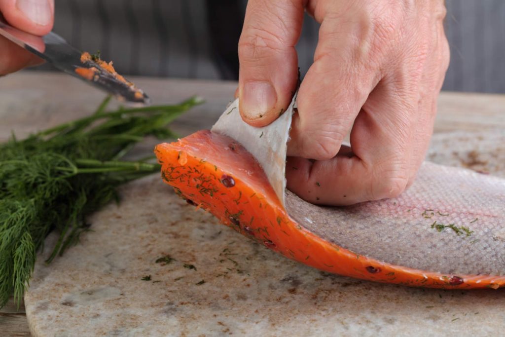 A photo of the fatty layer just below the skin of a salmon.