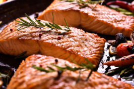 seafood grilling salmon fillets on a grill