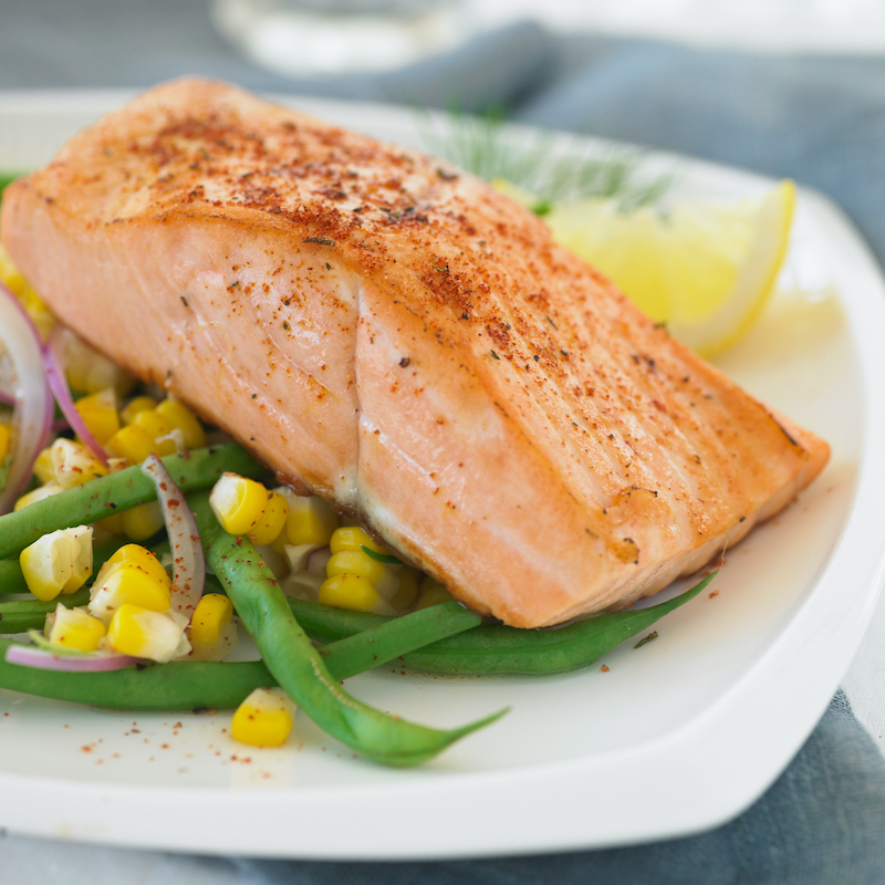 A photo of omega-3 salmon featuring a broiled fillet of Copper River King salmon.