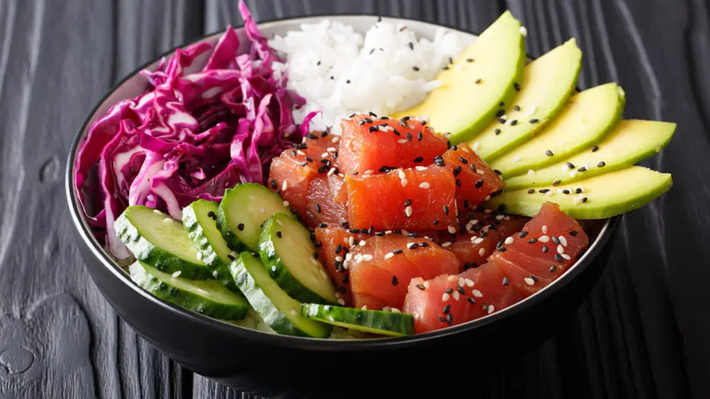 Seafood and vegetable pairings with a poke bowl with tuna, avocado, and other ingredients.