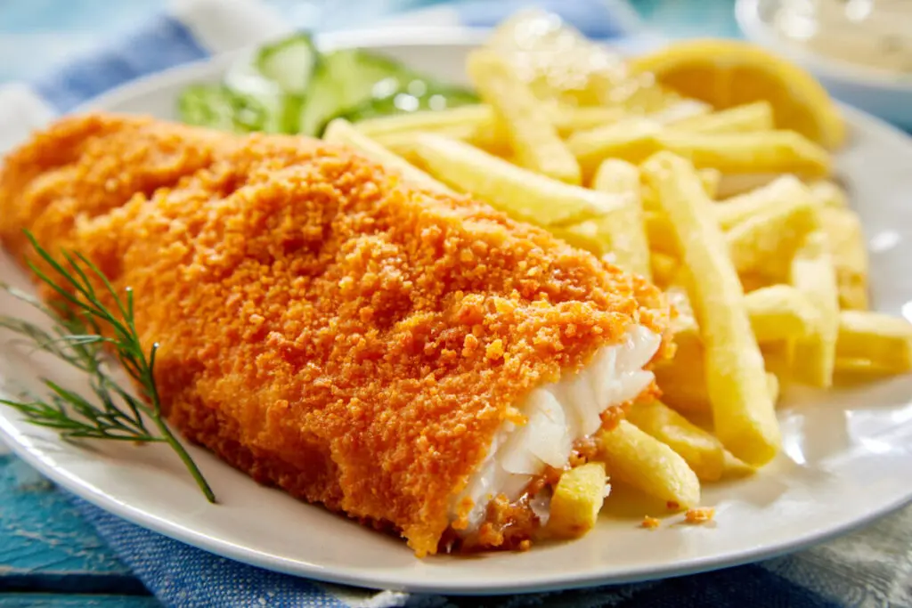 Portion of crispy fish with french fries