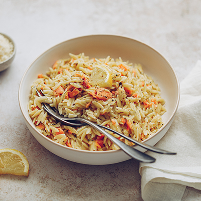 Seafood recipes with a bowl of salmon orzo.