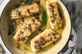 Halibut recipe in a pan with brown butter and fried sage.