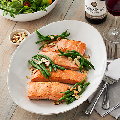 Thanksgiving fish recipes with a platter of poached salmon and green beans.