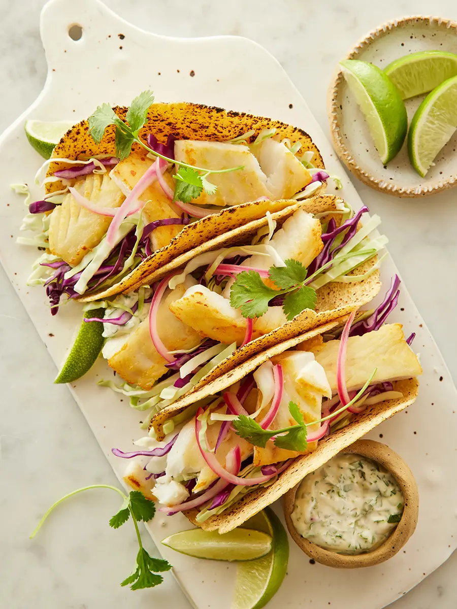 Halibut questions with a platter of fish tacos.